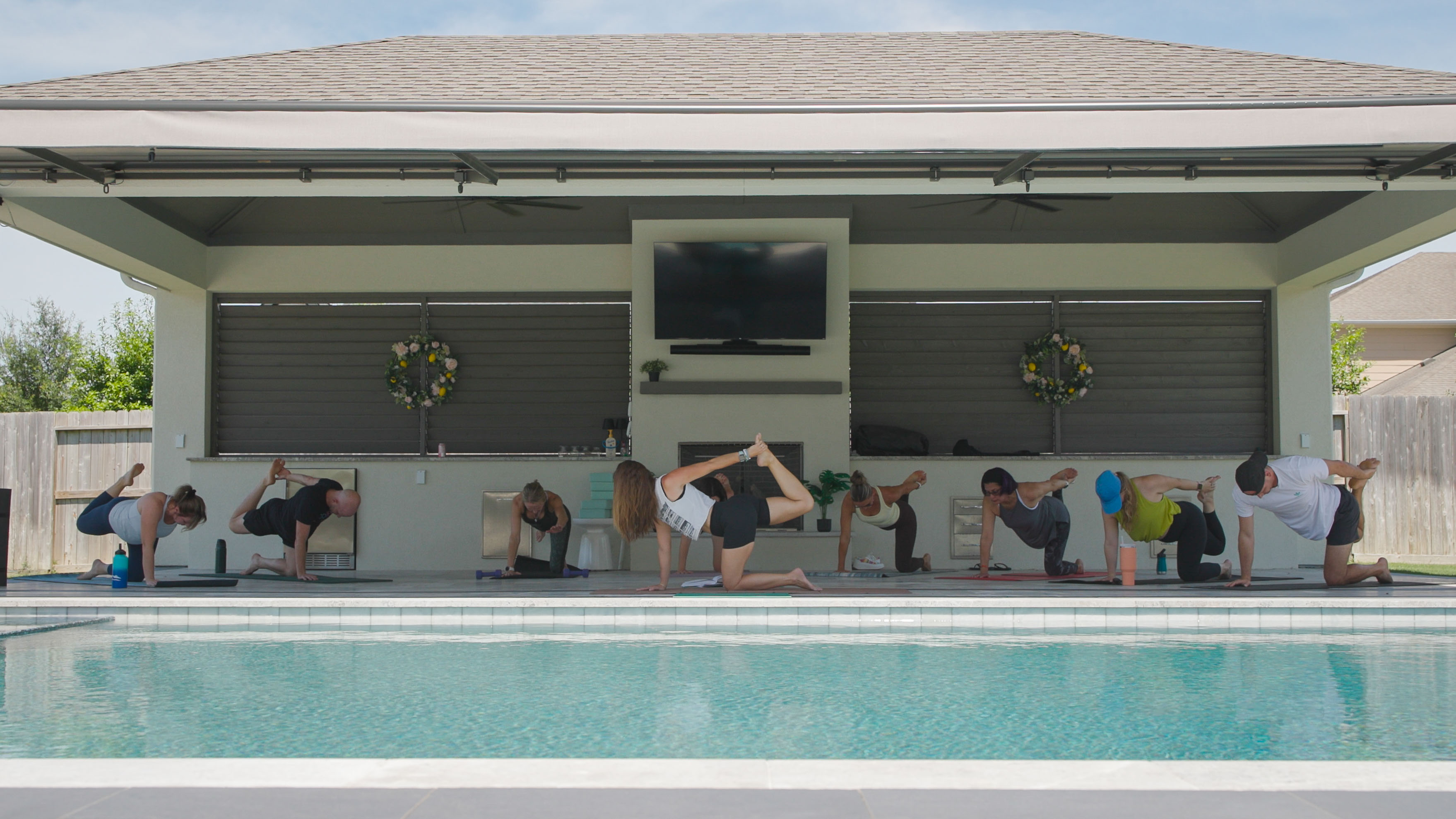 Chelsea teaching outdoor yoga class at the park