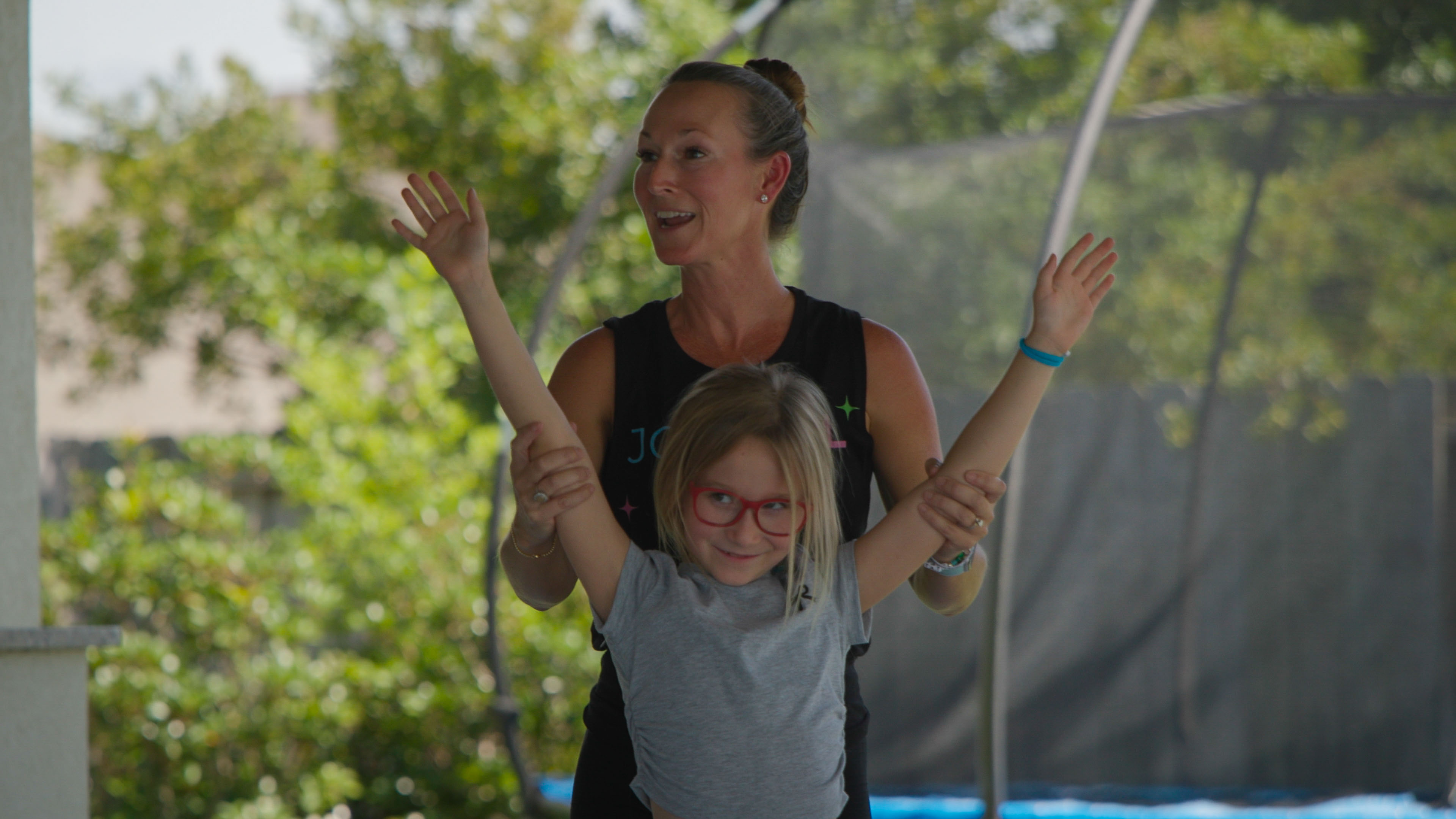 Chelsea and student in JOYFULL YOGA shirts